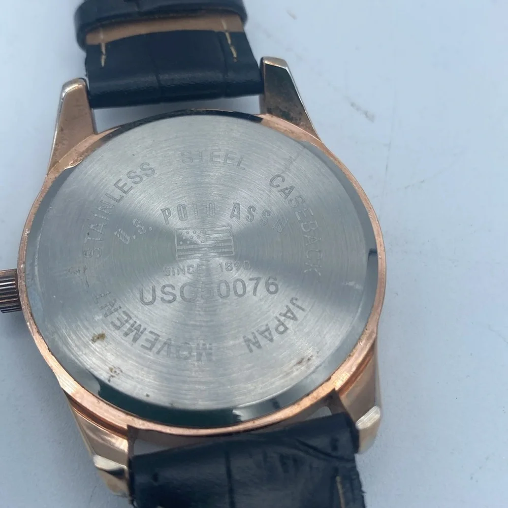 US Polo Assn rose gold tone wristwatch faux leather black band needs battery